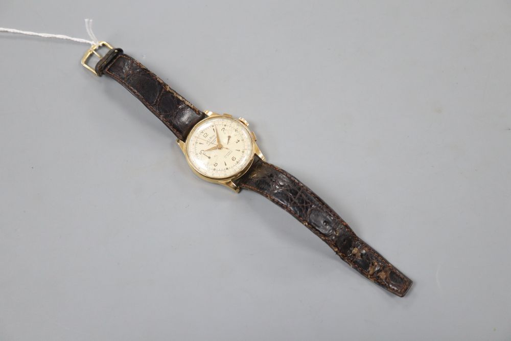 A gentlemans 18k Delrio chronograph manual wind wrist watch. case diameter 38mm, gross 45.9 grams.